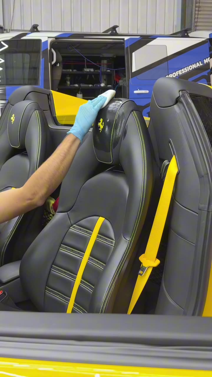 Interior protection being applied to an upholstered seat so spills bead rather than soak in